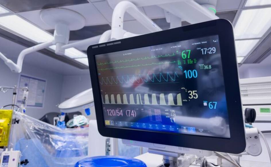 Hospital monitor displaying vital signs emphasizing healthcare technology