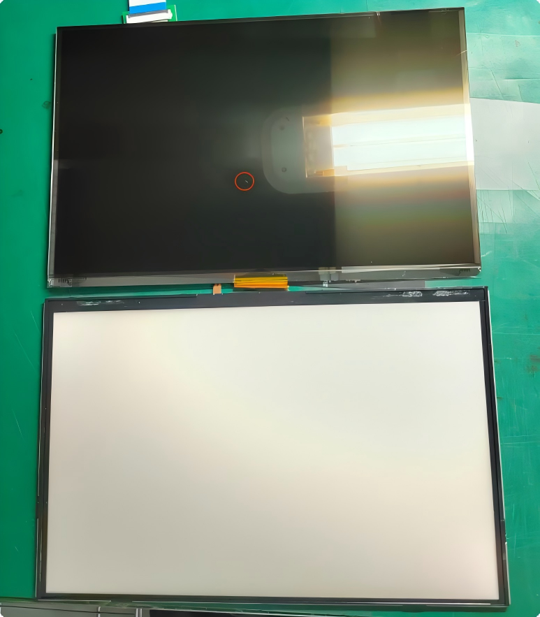 black spots caused by trapped dust particles inside LCD panels