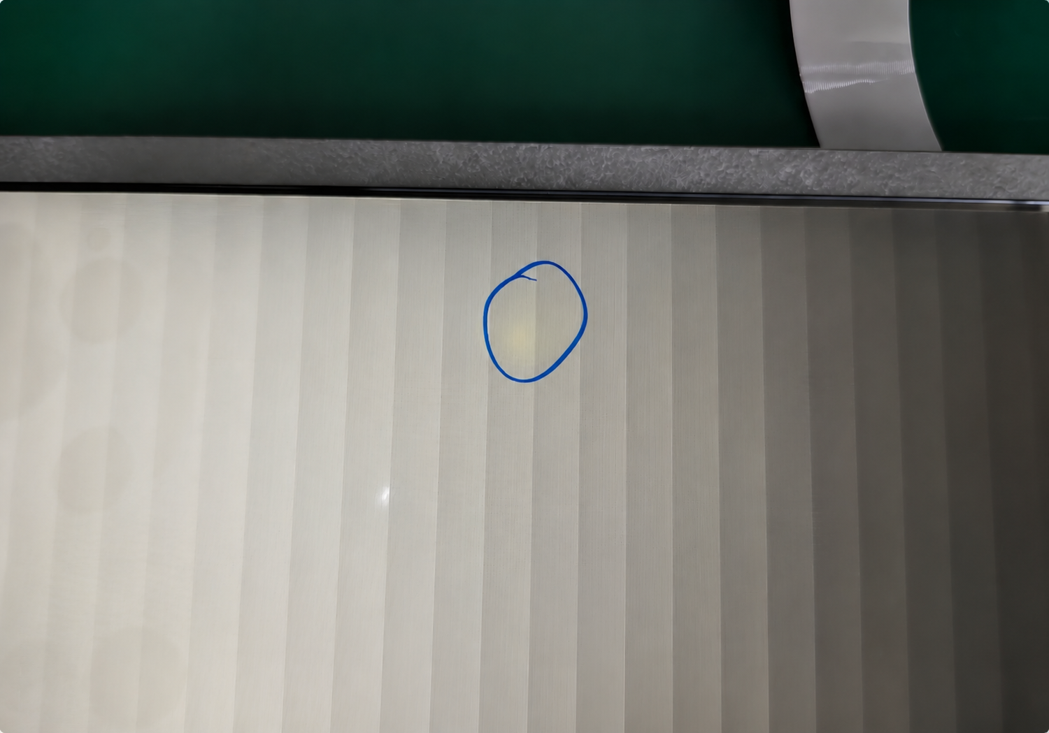 Faint LCD yellowing spot detected during display quality inspection